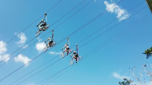 Low angle view of people cycling on rope at eden nature park and resort