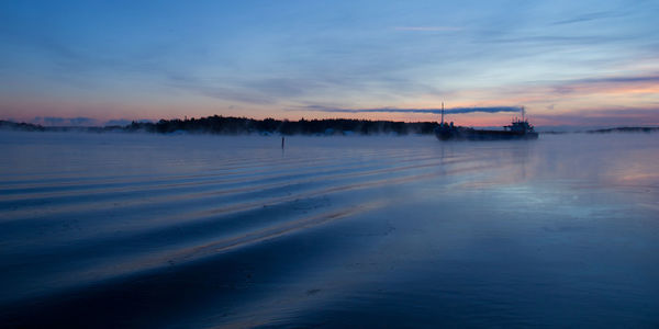 Scenic view of sea at sunset