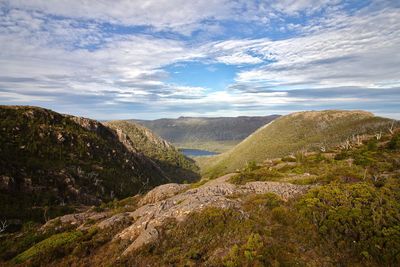 Scenic view of landscape against cloudy sky