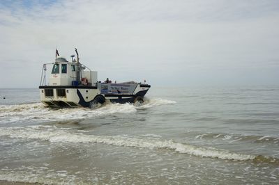 Ship in sea against sky