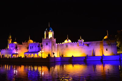 Reflection of illuminated buildings in water