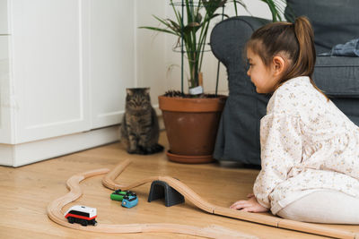 Cute girl playing with train