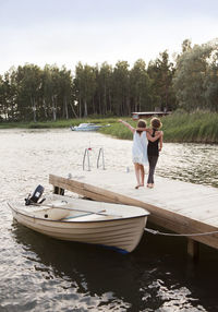 Two girls walking on jetty