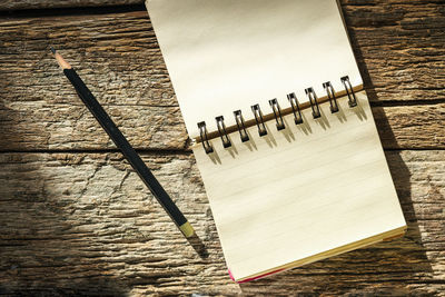 High angle view of paper on table against wall