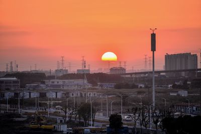 View of city against sky during sunset