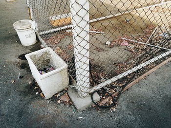 High angle view of garbage in cage