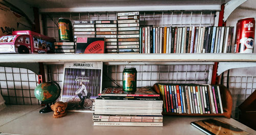 Stack of books in shelf at home