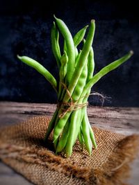 High angle view of vegetables on table against black background