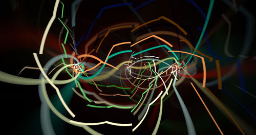 Close-up of light painting against black background