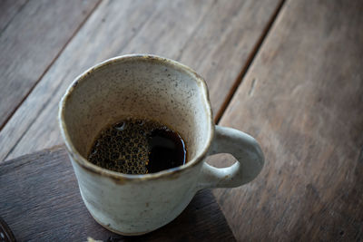 High angle view of coffee cup on table