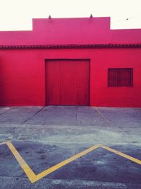 Empty road by building