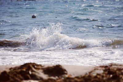 Close-up of waves splashing on sea