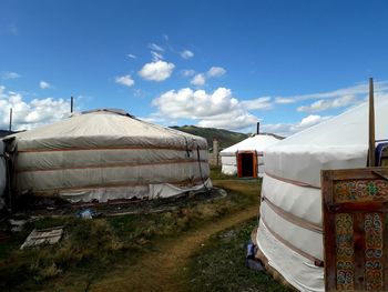 Tent on field against sky