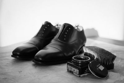 Close-up of shoes on table