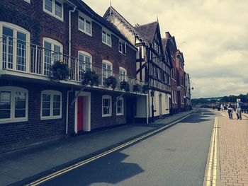 Road along buildings in city