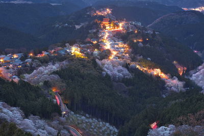 High angle view of illuminated city at night