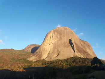 Rock formations on mountain against sky