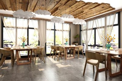 Empty chairs and tables in restaurant