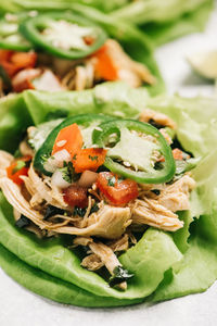 Closeup of whole30 shredded chicken lettuce wrapped tacos