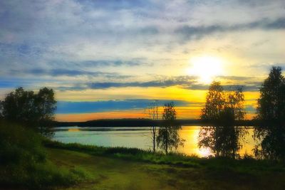 Scenic view of lake against sky during sunset