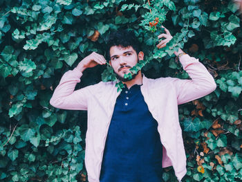 Portrait of young man standing outdoors