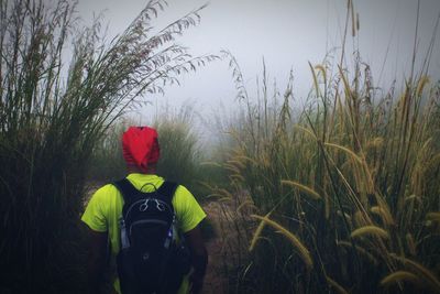 Woman standing on grassy field
