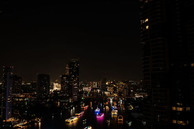 Illuminated buildings in city at night