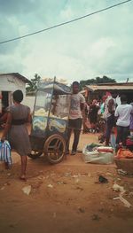 People on street against sky