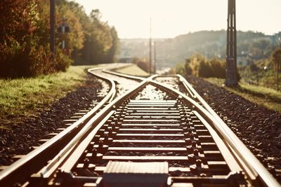 Surface level of railroad tracks against sky