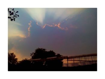 Scenic view of cloudy sky at sunset