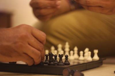 People playing chess at home