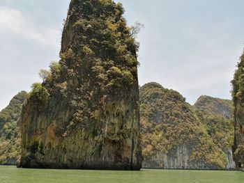 View of rock formation on land against sky