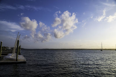 Sailboat in sea against sky