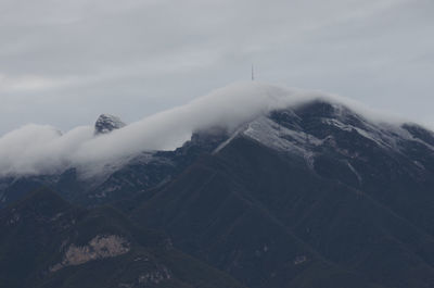 Clouds over mountain range