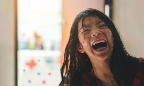 Cheerful girl with tousled hair