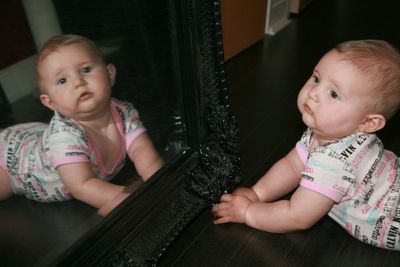 Portrait of cute baby girl at home