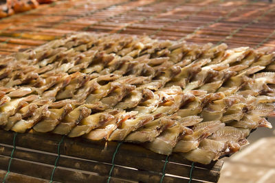 High angle view of meat on barbecue grill