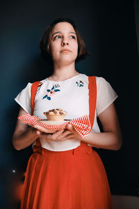 Woman holding a homemade muffin