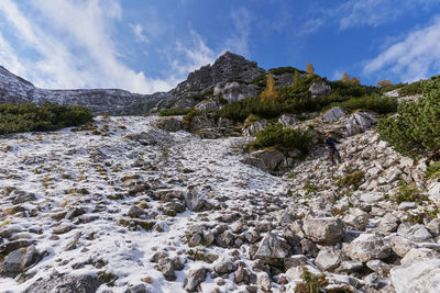 Rear view of people hiking on snowcapped mountain in triglav national park in slovenia