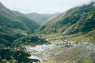 High angle view of agricultural field against mountains