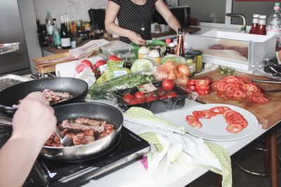 Close-up of person preparing food in kitchen