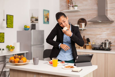 Man eating while working at home