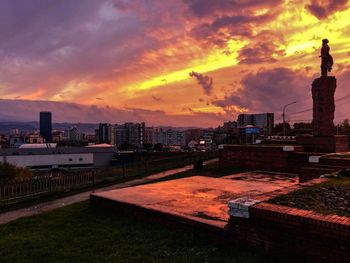 Buildings against sky during sunset