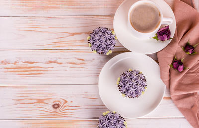 High angle view of cup and coffee on table