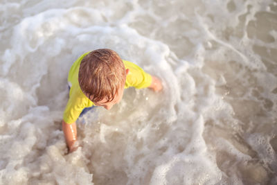 High angle view of boy on beach