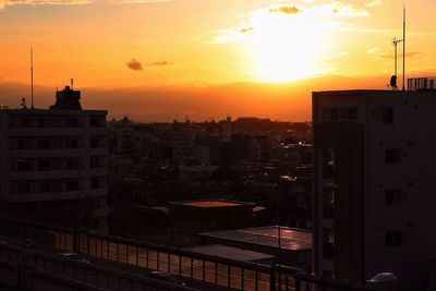 Cityscape against sky during sunset