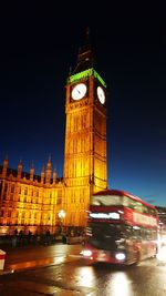 Low angle view of tower at night