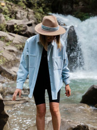 Full length of woman standing in water