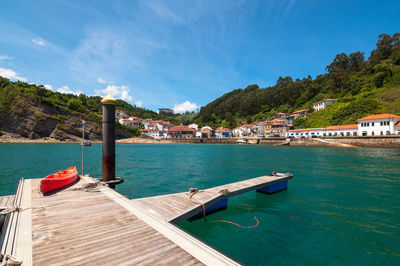 Scenic view of swimming pool by sea against sky