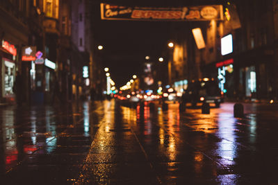 Wet city street at night